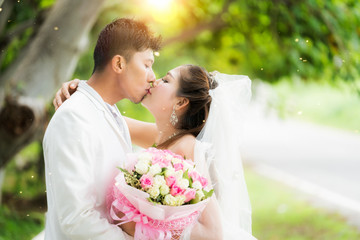 Couple just wedding hug and kiss in nature background