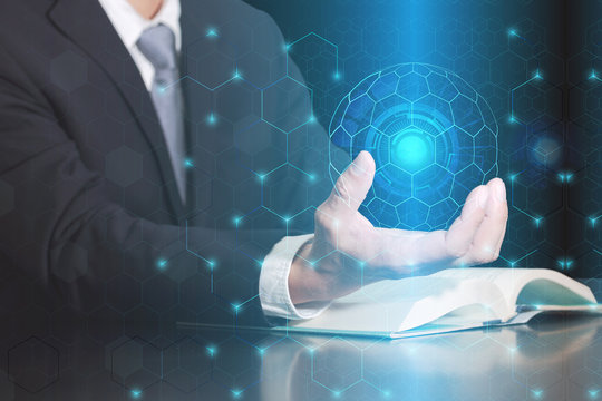Double exposure of businessman hand hold, hexagonal pattern design tech innovation background as business, controller, technology cyber and globalization concept.