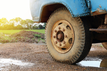 Fototapeta na wymiar dirty truck wheel on ground