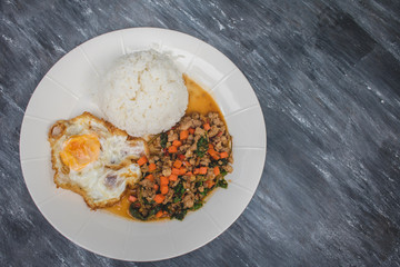 Kao Pad Kra Prao or Thai rice with pork and basil and fried egg