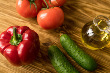 Salad ingridients. Tomato, olive, oil, paprika and cucumber.