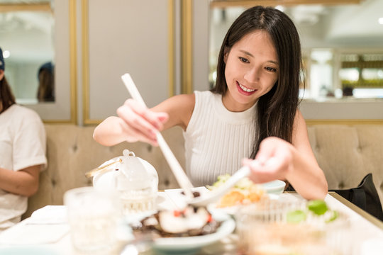 Woman having dinner in chinese restaurant