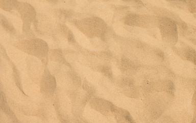 closeup of sand pattern of a beach in the summer