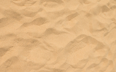 closeup of sand pattern of a beach in the summer