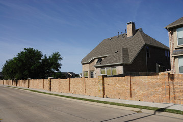 luxury houses inside wall surrounded community in the city