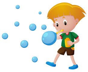 Boy blowing bubbles alone