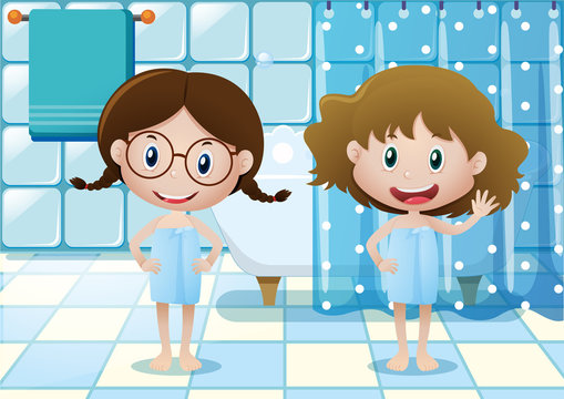 Two girls in bath towels in bathroom