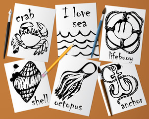 Graphic drawings of marine animals made with black mascara on white paper. Pencil, brush and pen on the table. Drawing and creativity on the sea theme. Vector