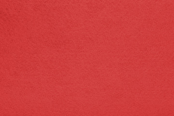 Background with red texture, velvet fabric, full frame, close-up