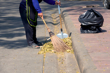 Street cleaning and sweeping with broom