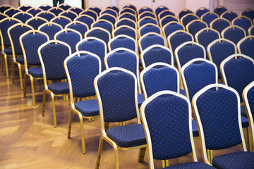 Obraz premium Rows of blue empty seats in unknown event hall