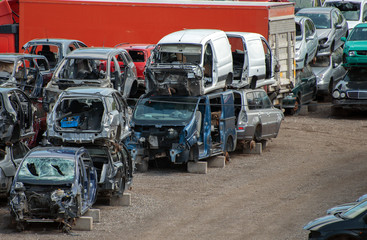 Old vehicles in scrap yard.