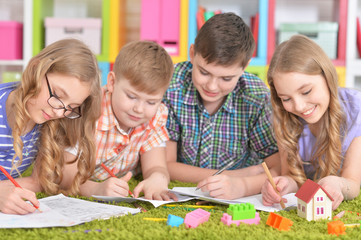 Fototapeta premium Group of children drawing with pencils