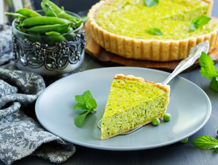 Homemade tart with green peas, bacon and cheese.