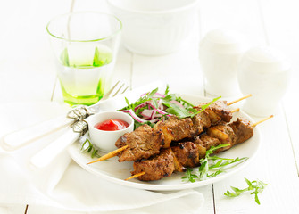Beef shish kebab  on skewers in curry.