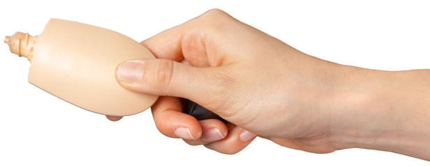 plastic tube for cosmetics in female hand.