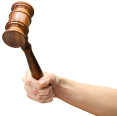 someones hand holding Wooden Law Gavel