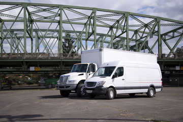 Semi truck and mini cargo van ready for delivery