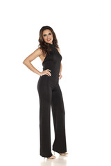 A woman in one-piece dress, trousers and blouses