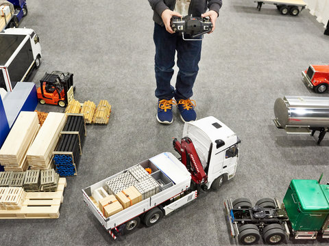 Boy drives truck model with control panel