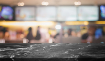 Black Stone table top and blurred restaurant interior background with vintage filter - can used for display or montage your products.