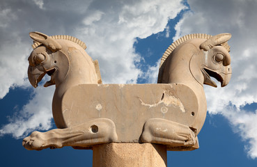 Homa the Griffin Capital Statuary in Persepolis of Shiraz in Iran Against Blue Sky with White...