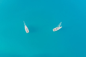 Top view of two white yachts at sea