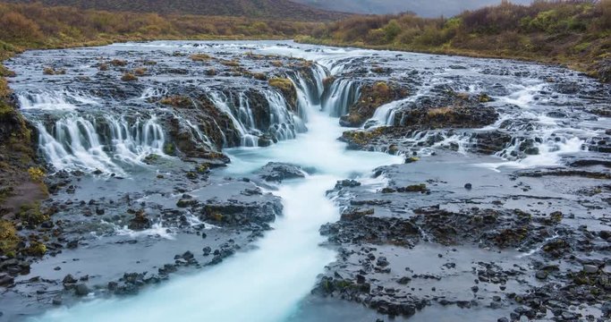 ICELAND – SEPTEMBER 2016 : Timelapse of Bruarfoss waterfalls on a cloudy day with amazing landscape in view