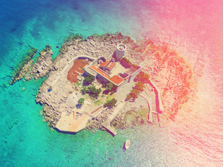 Top view of the island with a fortress in the sunlight