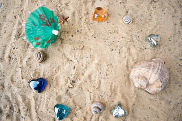 Hearts on a sandy sunny beach with a blurred background.