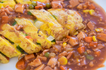 Omelet served with ham sauce