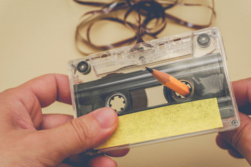 man rewind a cassette tape