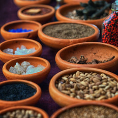Different spices in clay plates