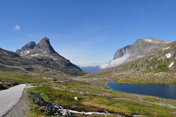 Fototapeta premium Road with lake and rocky mountains in Norway.
