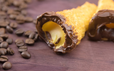 delicious sicilian cannolo cannellino sweet with pastry hazelnut near coffee beans