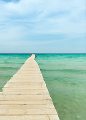 View from a wooden pier over the ocean