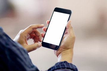 Man using smartphone on blur background. Blank screen smartphone for Graphic display montage.