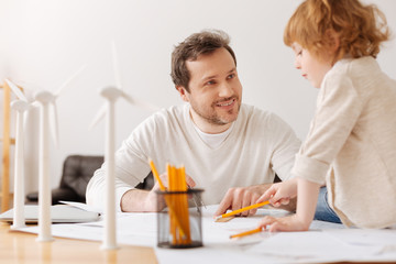 Positive delighted bearded man having conversation with his