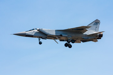 Fototapeta na wymiar Fighter plane in a blue sky