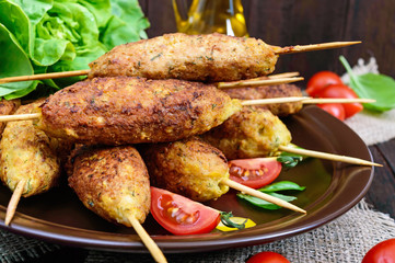 Lula-kebab is a meat dish, traditional for the Caucasus, in Central Asia and Turkey. Minced meat strung on a skewer and fried. Serve on a plate with lettuce leaves and fresh tomatoes.