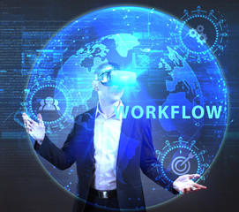 The concept of business, technology, the Internet and the network. A young entrepreneur working on a virtual screen of the future and sees the inscription: Workflow
