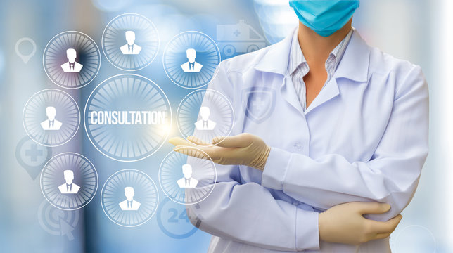Doctor conducts a consultation with patients .