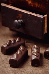 Luxury handmade candies on wooden background