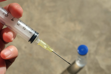 syringe and vial of drug