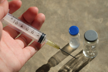 syringe and vial of drug