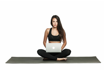 Young brunette woman working on her laptop