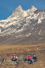 Fototapeta premium Group of people are having lunch in the mountains