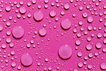 Fuchsia abstract background, rain drops on surface