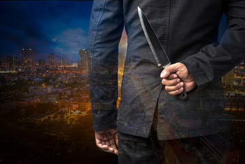 Businessman hold on knife
