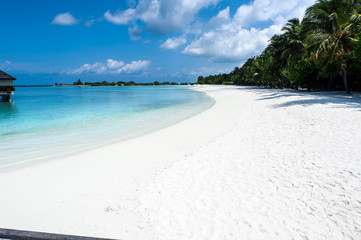 Happy days in Maldives, islands with vivid clear sea water, pretty endless beach, soft white sands, luxury water villa, wonderful sunset and sun rise, blue sky with clouds.